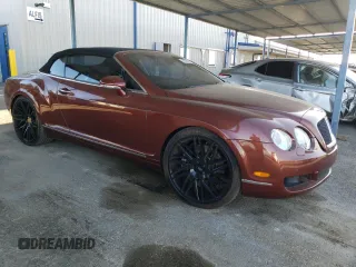 2007 Bentley Continental GT with VIN SCBDR33W77C047935, listed as a Copart auction lot 60557985 with 61,661 mi miles and Salvage title. Bid and sale history available at DreamBid. Image 4.