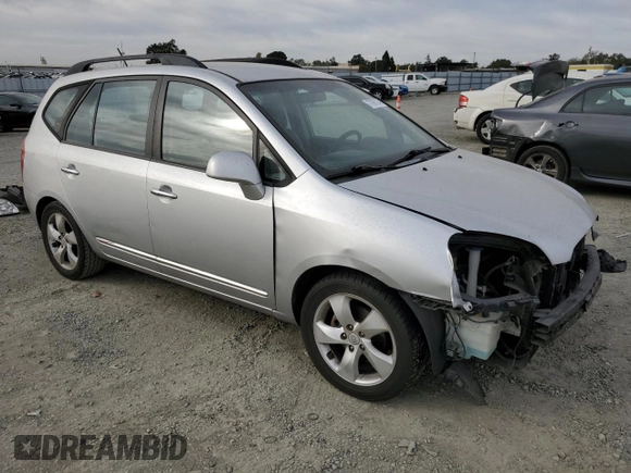 2009 Kia Rondo LX Base with VIN KNAFG528097222268, listed as a Copart auction lot 77797124 with 184,569 mi miles and Salvage Title. Bid and sale history available at carsss.com. Image 4.