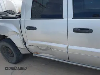 2006 Mitsubishi Raider LS z VIN 1Z7HT28KX6S576515, wystawiony jako IAAI lot #42180535 z przebiegiem 169 922 mil mil oraz . Historia ofert i sprzedaży dostępna na DreamBid. Obrazek 6.