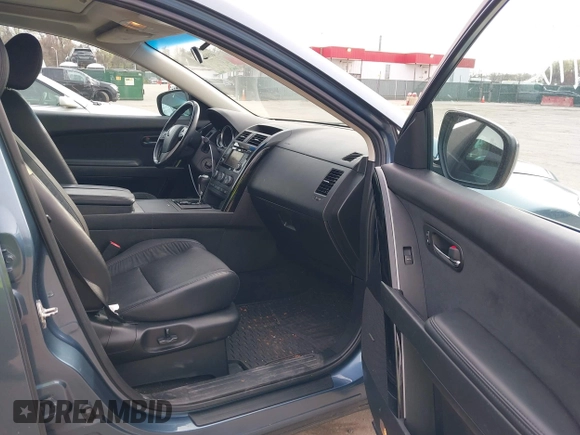 2015 Mazda CX-9 Touring with VIN JM3TB3CVXF0460959, listed as a IAAI auction lot 41940912 with 166,674 mi miles and . Bid and sale history available at DreamBid. Image 5.