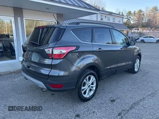 2018 Ford Escape SE with VIN 1FMCU9GD8JUA76991, listed as a IAAI auction lot 42013849 with 213,827 mi miles. Bid and sale history available at carsss.com. Image 4.