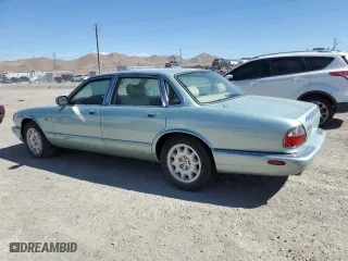 2000 Jaguar XJ with VIN SAJDA14C1YLF10459, listed as a Copart auction lot 65583394 with 113,333 mi miles and Salvage Title. Bid and sale history available at carsss.com. Image 2.