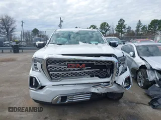 2020 GMC Sierra 1500 Denali z VIN 3GTU9FELXLG371258, wystawiony jako IAAI lot #41303490 z przebiegiem 63 571 mil mil oraz . Historia ofert i sprzedaży dostępna na DreamBid. Obrazek 12.