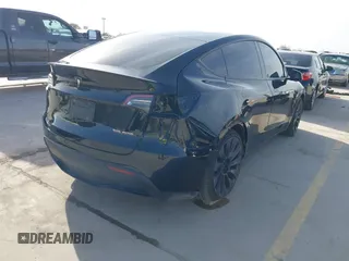 2022 Tesla Model Y Performance with VIN 7SAYGDEF6NF532027, listed as a IAAI auction lot 41717662 with 36,537 mi miles and . Bid and sale history available at DreamBid. Image 4.