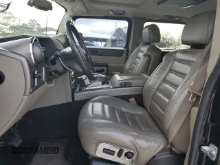 2004 Hummer H2 with VIN 5GRGN23U54H118187, listed as a Copart auction lot 76258264 with 169,531 mi miles and Salvage Title. Bid and sale history available at carsss.com. Image 7.