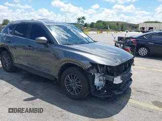 2020 Mazda CX-5 Touring with VIN JM3KFACM9L0826742, listed as a IAAI auction lot 41903755 with 73,409 mi miles and . Bid and sale history available at DreamBid. Image 1.