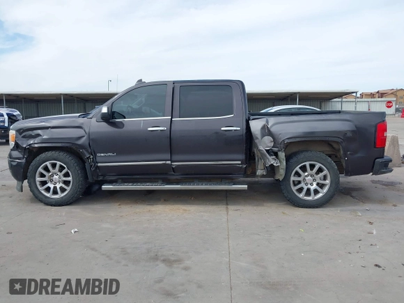 2015 GMC Sierra 1500 Denali with VIN 3GTU2WEJ2FG509236, listed as a IAAI auction lot 41771790 with 219,043 mi miles. Bid and sale history available at carsss.com. Image 14.