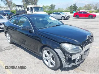 2014 Mercedes-Benz C-Class C 250 with VIN WDDGJ4HBXEG296917, listed as a IAAI auction lot 42068339 with 124,872 mi miles. Bid and sale history available at carsss.com. Image 1.
