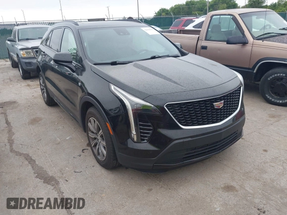2019 Cadillac XT4 AWD Sport z VIN 1GYFZFR48KF197731, wystawiony jako IAAI lot #42668639 z przebiegiem 73 170 mil mil oraz . Historia ofert i sprzedaży dostępna na DreamBid. Obrazek 1.