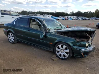 2004 Jaguar X-Type with VIN SAJEA51C34WE19153, listed as a Copart auction lot 77452474 with 0 mi miles and Salvage Title. Bid and sale history available at carsss.com. Image 4.