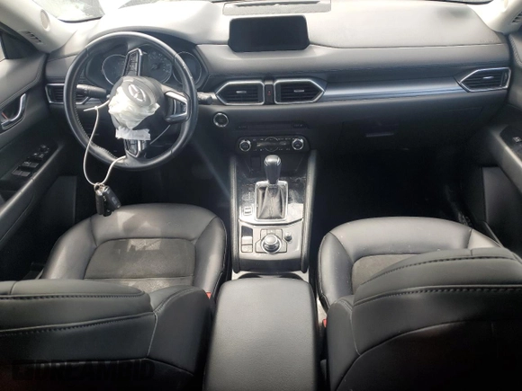 2017 Mazda CX-5 Touring z VIN JM3KFBCL2H0129000, wystawiony jako Copart lot #52107005 z przebiegiem 55 411 mil mil oraz Szkody całkowita. Historia ofert i sprzedaży dostępna na DreamBid. Obrazek 8.