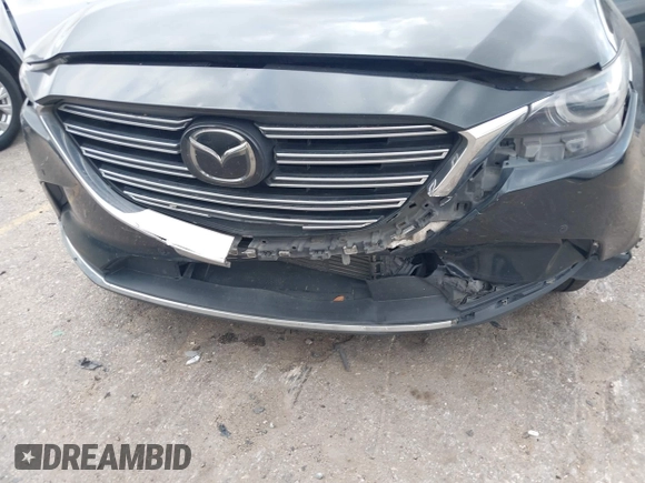 2018 Mazda CX-9 Grand Touring with VIN JM3TCADY3J0205878, listed as a IAAI auction lot 42178507 with 243,703 mi miles and . Bid and sale history available at DreamBid. Image 6.