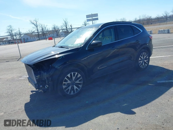 2020 Ford Escape Titanium z VIN 1FMCU9J98LUA44923, wystawiony jako IAAI lot #41779691 z przebiegiem 73 259 mil mil oraz . Historia ofert i sprzedaży dostępna na DreamBid. Obrazek 2.