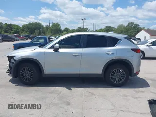 2017 Mazda CX-5 Sport with VIN JM3KFABLXH0135560, listed as a IAAI auction lot 42062016 with 153,416 mi miles. Bid and sale history available at carsss.com. Image 15.