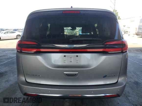 2021 Chrysler Pacifica Hybrid Touring L with VIN 2C4RC1L7XMR593911, listed as a Copart auction lot 57842415 with 74,910 mi miles and Salvage title. Bid and sale history available at DreamBid. Image 6.