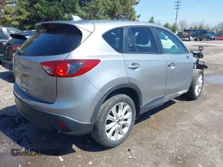 2013 Mazda CX-5 Grand Touring with VIN JM3KE4DE9D0137085, listed as a IAAI auction lot 41978534 with 103,720 mi miles and . Bid and sale history available at carsss.com. Image 4.