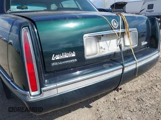 1995 Cadillac Concours z VIN 1G6KF52YXSU302434, wystawiony jako IAAI lot #42231281 z przebiegiem 153 236 mil mil oraz . Historia ofert i sprzedaży dostępna na DreamBid. Obrazek 17.