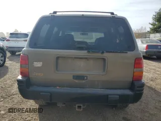 1998 Jeep Grand Cherokee Laredo with VIN 1J4GZ48YXWC299827, listed as a Copart auction lot 76898264 with 232,656 mi miles and Clean Title. Bid and sale history available at carsss.com. Image 6.