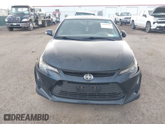 2015 Scion tC with VIN JTKJF5C7XFJ001662, listed as a IAAI auction lot 41843123 with 128,851 mi miles. Bid and sale history available at carsss.com. Image 12.
