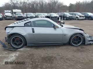 2003 Nissan 350Z Touring z VIN JN1AZ34E33T003711, wystawiony jako IAAI lot #41351191 z przebiegiem 167 503 mil mil oraz . Historia ofert i sprzedaży dostępna na DreamBid. Obrazek 13.