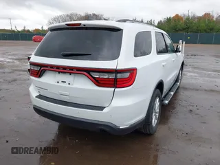 2015 Dodge Durango SXT with VIN 1C4RDJAG8FC239977, listed as a IAAI auction lot 40764725 with 133,809 mi miles and . Bid and sale history available at carsss.com. Image 4.