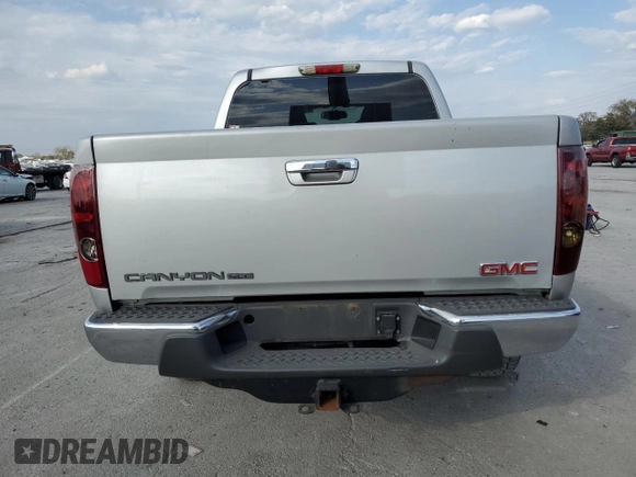 2012 GMC Canyon SLE1 with VIN 1GTH5MFE8C8156663, listed as a Copart auction lot 77385804 with 196,437 mi miles and Salvage Title. Bid and sale history available at carsss.com. Image 6.