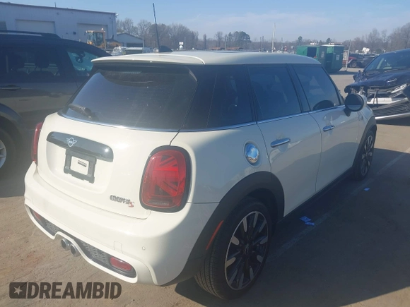 2021 MINI Hardtop 4 Door Cooper S with VIN WMWXU9C00M2P04693, listed as a IAAI auction lot 41785185 with 57,848 mi miles and . Bid and sale history available at DreamBid. Image 4.