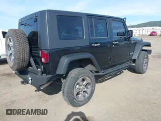 2009 Jeep Wrangler Unlimited X with VIN 1J4GA391X9L701403, listed as a IAAI auction lot 41890659 with 143,619 mi miles. Bid and sale history available at carsss.com. Image 4.