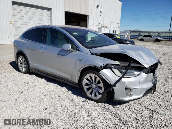 2016 Tesla Model X 70D with VIN 5YJXCAE29GF004033, listed as a Copart auction lot 49673975 with 220,259 mi miles and Salvage Title. Bid and sale history available at DreamBid. Image 4.