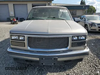 1999 GMC Yukon with VIN 1GKEK13R9XJ740395, listed as a Copart auction lot 83801394 with 185,305 mi miles and Salvage Title. Bid and sale history available at carsss.com. Image 5.