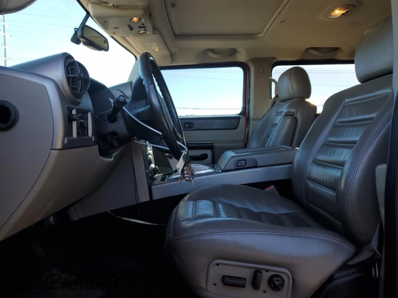 2003 Hummer H2 with VIN 5GRGN23U33H125797, listed as a Copart auction lot 77170554 with 166,739 mi miles and Clean Title. Bid and sale history available at carsss.com. Image 7.
