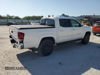 2023 Toyota Tacoma SR5 z VIN 3TMAZ5CN3PM212056, wystawiony jako Copart lot #57217735 z przebiegiem 36 533 mil mil oraz Szkoda całkowita • Salvage title. Historia ofert i sprzedaży dostępna na DreamBid. Obrazek 3.