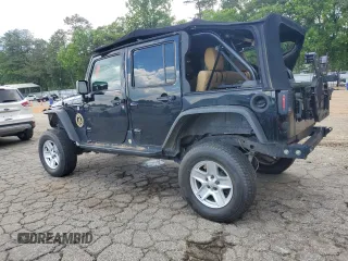 2012 Jeep Wrangler Unlimited Sport z VIN 1C4BJWDG7CL208265, wystawiony jako Copart lot #56101095 z przebiegiem 141 527 mil mil oraz Szkoda całkowita • Salvage title. Historia ofert i sprzedaży dostępna na DreamBid. Obrazek 2.