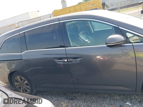 2014 Honda Odyssey Touring with VIN 5FNRL5H99EB111685, listed as a IAAI auction lot 42141227 with 183,484 mi miles and . Bid and sale history available at DreamBid. Image 13.