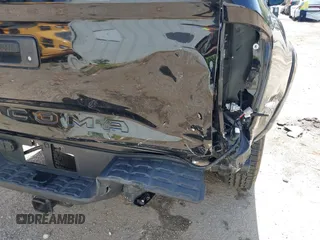 2023 Toyota Tacoma SR with VIN 3TMCZ5AN1PM654572, listed as a IAAI auction lot 42312575 with 14,111 mi miles and . Bid and sale history available at DreamBid. Image 6.