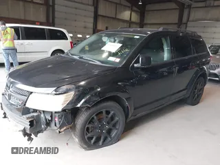 2013 Dodge Journey SXT with VIN 3C4PDDBG0DT660956, listed as a IAAI auction lot 41593385 with 196,021 mi miles and . Bid and sale history available at DreamBid. Image 2.
