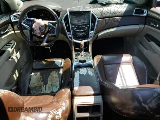 2015 Cadillac SRX Performance Collection z VIN 3GYFNCE31FS638057, wystawiony jako Copart lot #52454065 z przebiegiem 198 417 mil mil oraz Czysty tytuł • Clean title. Historia ofert i sprzedaży dostępna na DreamBid. Obrazek 8.