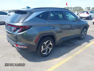 2022 Hyundai Tucson SEL z VIN 5NMJCCAE4NH096813, wystawiony jako IAAI lot #41899641 z przebiegiem 23 668 mil mil oraz . Historia ofert i sprzedaży dostępna na DreamBid. Obrazek 4.