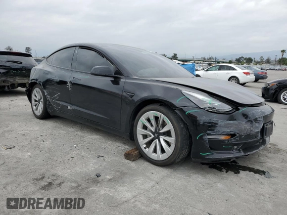 2022 Tesla Model 3 with VIN 5YJ3E1EA3NF190102, listed as a Copart auction lot 50657535 with 73,015 mi miles and Salvage Title. Bid and sale history available at DreamBid. Image 4.