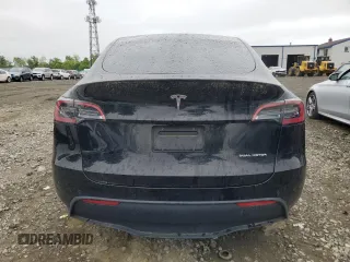 2022 Tesla Model Y Long Range z VIN 7SAYGDEE2NF313492, wystawiony jako Copart lot #55748695 z przebiegiem Nie podano mil oraz Szkoda całkowita • Salvage title. Historia ofert i sprzedaży dostępna na DreamBid. Obrazek 6.
