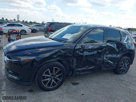 2018 Mazda CX-5 Grand Touring with VIN JM3KFBDM2J0390611, listed as a IAAI auction lot 42006482 with 97,497 mi miles. Bid and sale history available at carsss.com. Image 6.