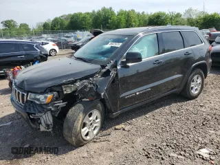 2017 Jeep Grand Cherokee Laredo with VIN 1C4RJFAG5HC882005, listed as a Copart auction lot 56623975 with 134,397 mi miles and Salvage title. Bid and sale history available at DreamBid. Image 1.