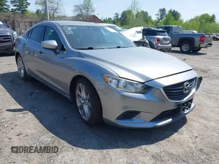 2014 Mazda 6 i Touring with VIN JM1GJ1T61E1136849, listed as a IAAI auction lot 42242211 with 130,843 mi miles and . Bid and sale history available at DreamBid. Image 1.
