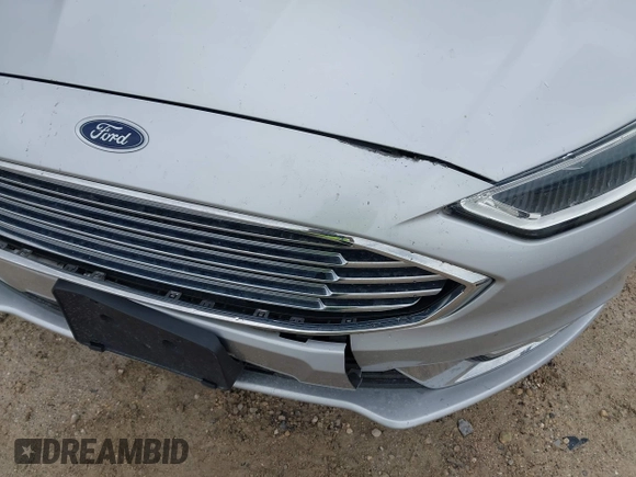 2017 Ford Fusion SE z VIN 3FA6P0HD5HR166433, wystawiony jako IAAI lot #42394998 z przebiegiem 121 333 mil mil oraz . Historia ofert i sprzedaży dostępna na DreamBid. Obrazek 17.