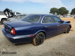 2004 Jaguar XJ with VIN SAJWA71C34SG19800, listed as a Copart auction lot 71877194 with 157,051 mi miles and Salvage Title. Bid and sale history available at carsss.com. Image 3.