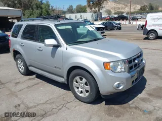 2009 Ford Escape Hybrid with VIN 1FMCU49309KC11542, listed as a IAAI auction lot 42028593 with 168,573 mi miles. Bid and sale history available at carsss.com. Image 1.