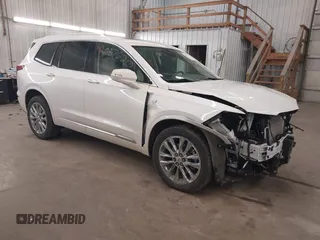 2022 Cadillac XT6 Premium Luxury z VIN 1GYKPDRS3NZ131095, wystawiony jako IAAI lot #42087620 z przebiegiem 36 740 mil mil oraz . Historia ofert i sprzedaży dostępna na DreamBid. Obrazek 1.