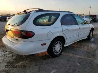 1999 Ford Taurus SE z VIN 1FAFP58S3XG308764, wystawiony jako Copart lot #43959225 z przebiegiem 120 936 mil mil oraz Szkoda całkowita • Salvage title. Historia ofert i sprzedaży dostępna na DreamBid. Obrazek 3.