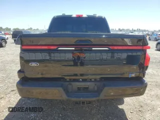 2023 Ford F-150 Lightning Pro with VIN 1FTVW1EV1PWG17333, listed as a Copart auction lot 57904025 with 21,173 mi miles and Salvage title. Bid and sale history available at DreamBid. Image 6.
