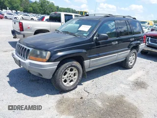 2000 Jeep Grand Cherokee Laredo with VIN 1J4GW48N7YC357376, listed as a IAAI auction lot 42503429 with 211,154 mi miles and . Bid and sale history available at DreamBid. Image 2.